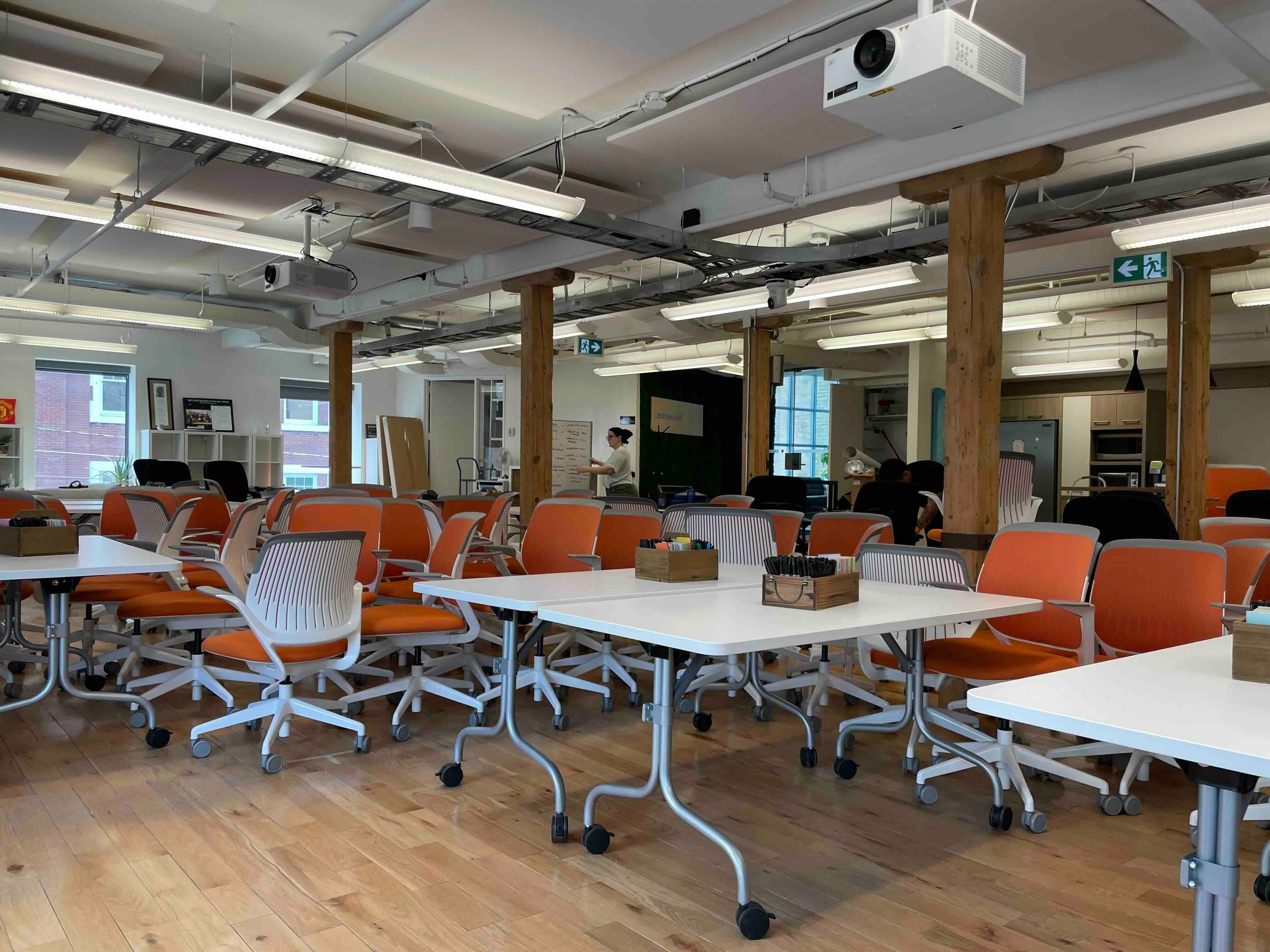 Wide open place office space filled with orange chairs shows just how quickly a change initiative can happen when everyone is on board.