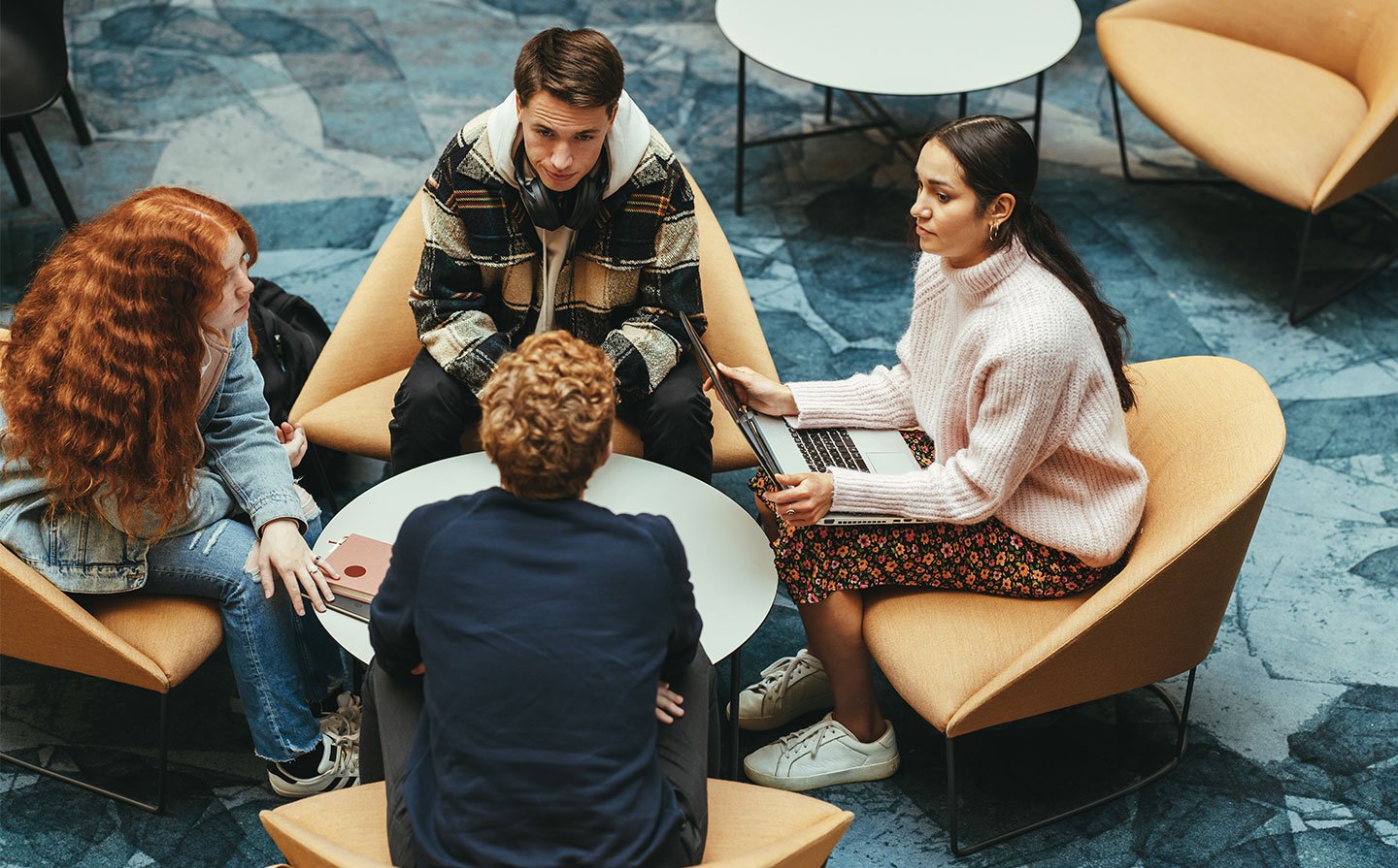 Executive education students collaborate in an open space