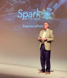 ExperiencePoint Facilitator Tom Merrill delivers a Spark episode in a live training program.